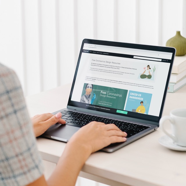 Person using a laptop to view free coronavirus design resources, relevant for Pay Monthly Websites for Coventry